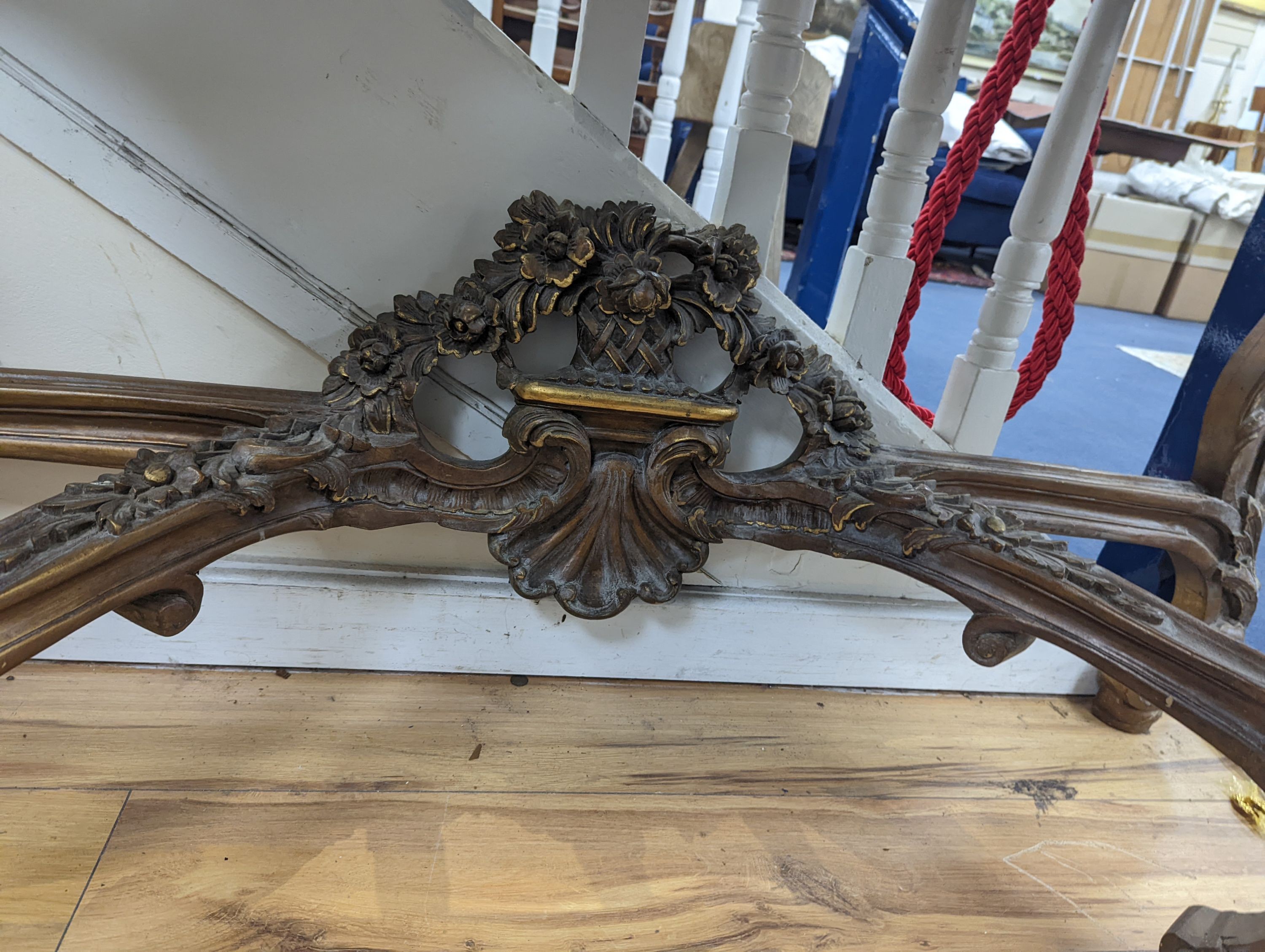 An 18th century style carved giltwood serpentine console table with serpentine marble top, width 140cm, depth 44cm, height 95cm